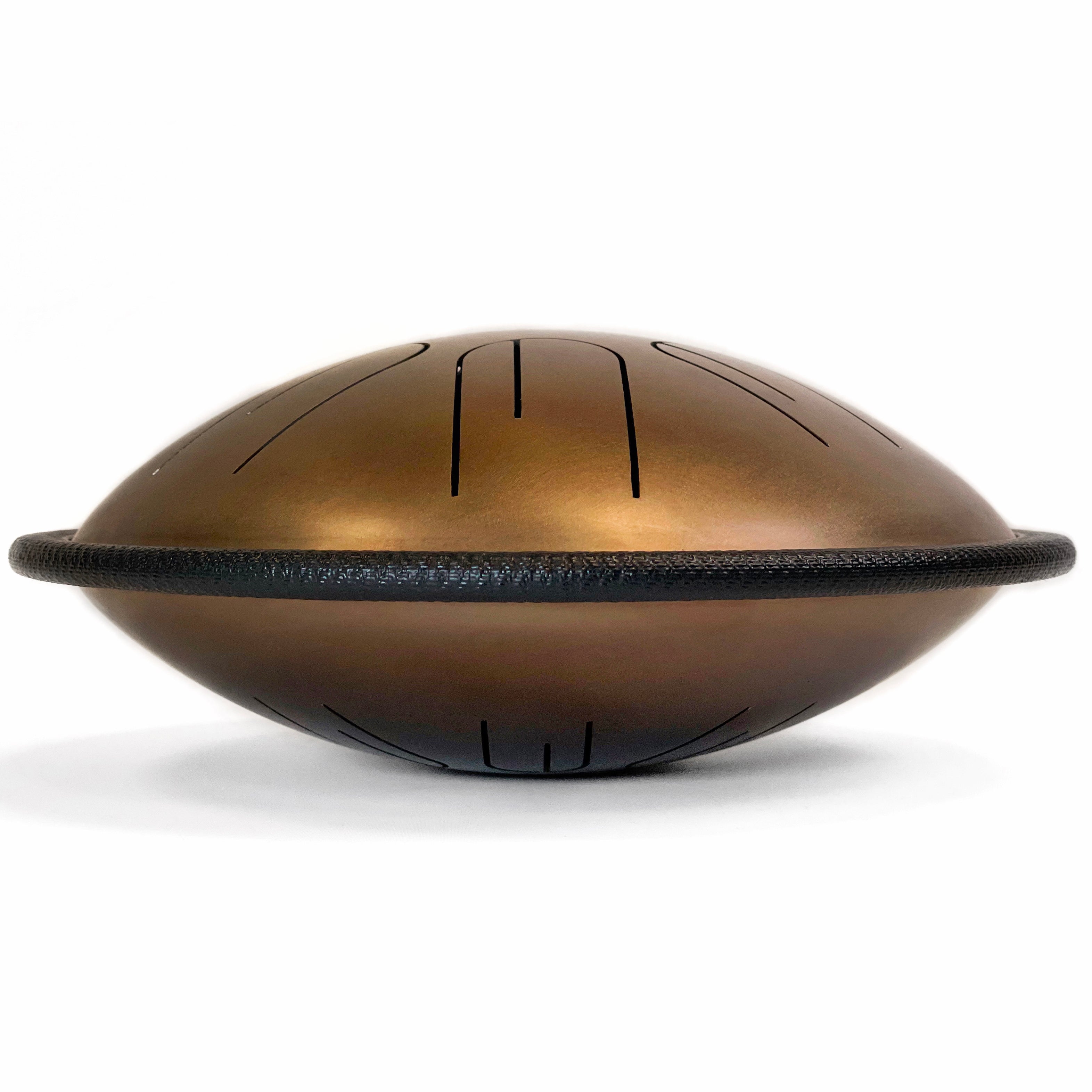 Side view of Novadrum 28 two-sided steel tongue drum in stainless steel, featuring a black protective rim and three rubber feet for stability.
