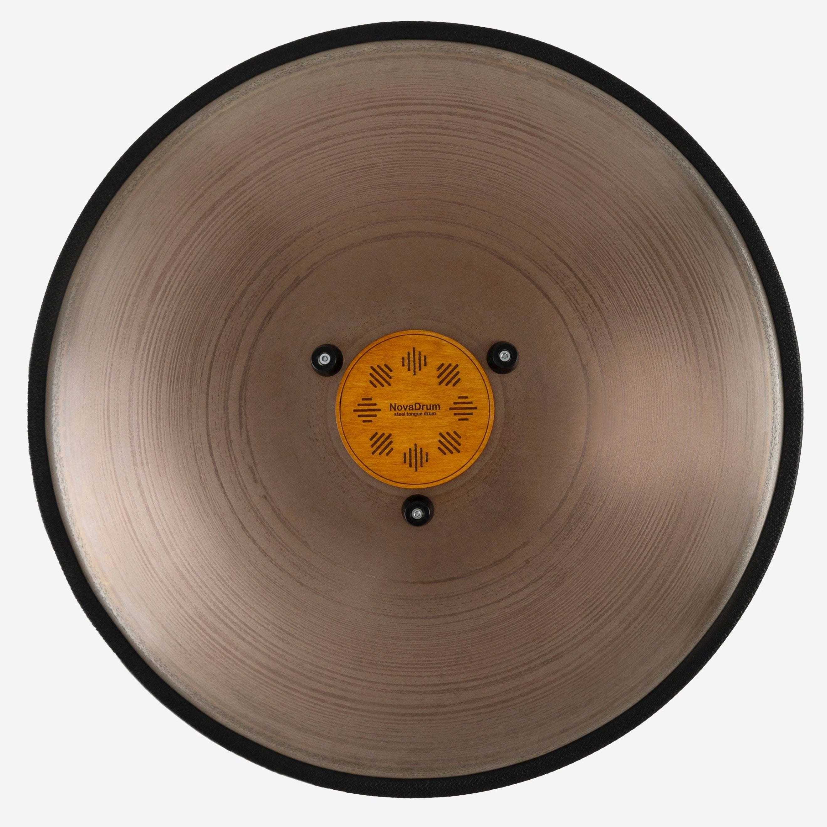 Back view of Novadrum 48 big steel tongue drum in stainless steel, showing a wooden cover with engraved ‘NovaDrum’ branding, rubber feet, and black rope rim.