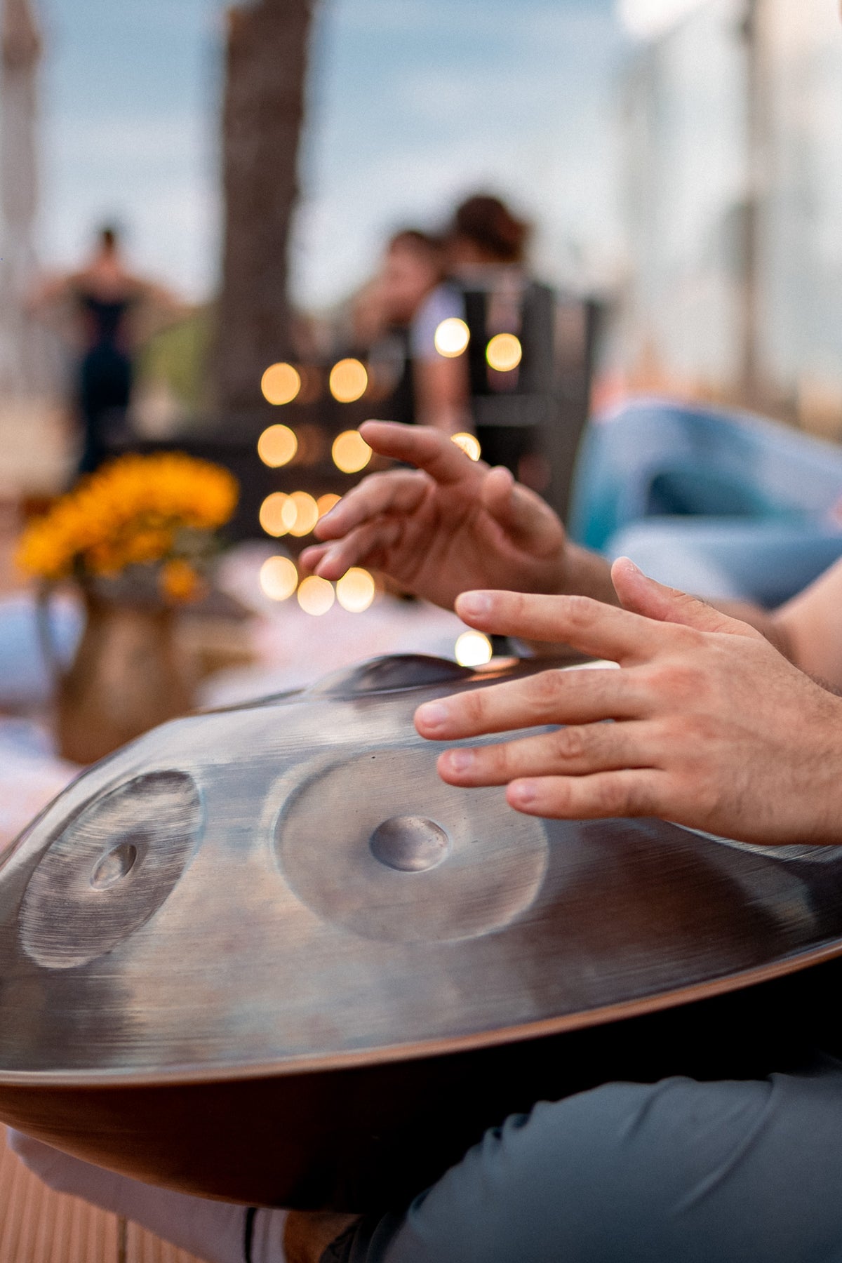 Handpan being played by hand outdoors