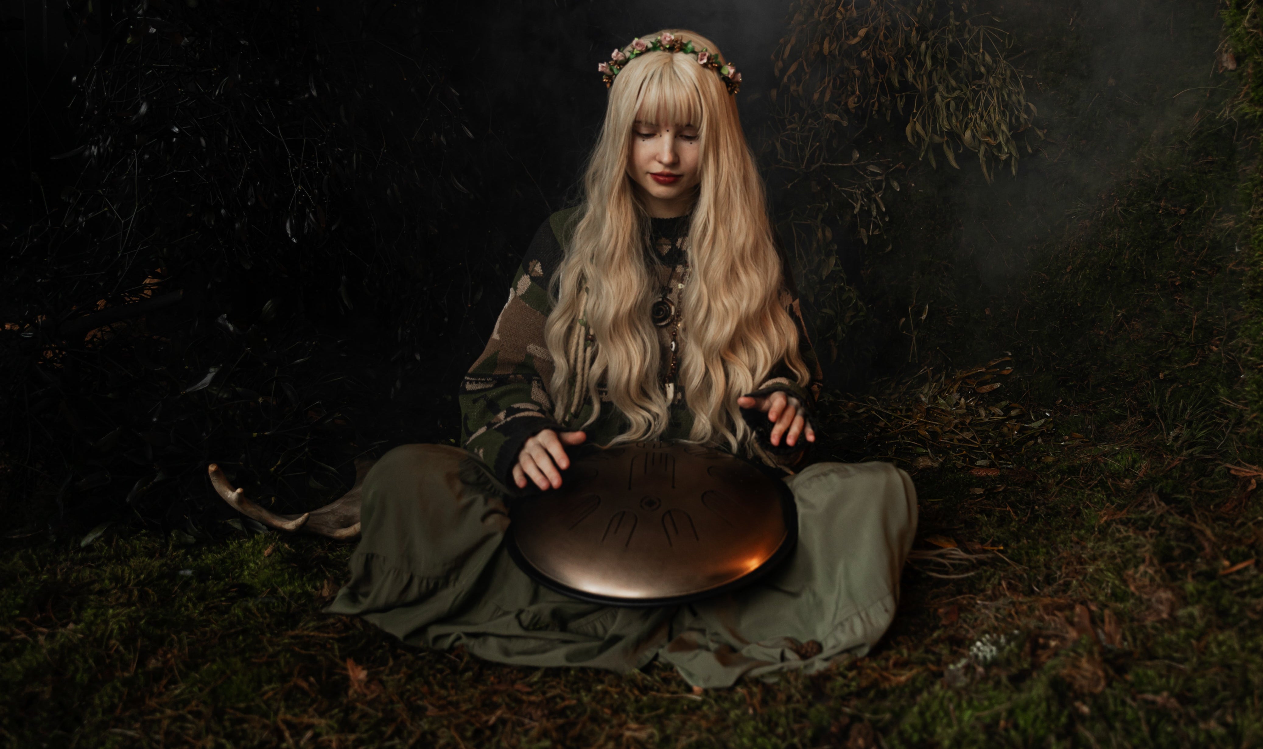 Person playing on Steel Tongue Drum