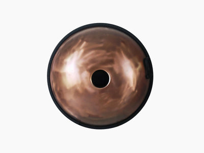 bottom view of a handcrafted Novadrum handpan with, featuring a brushed bronze finish