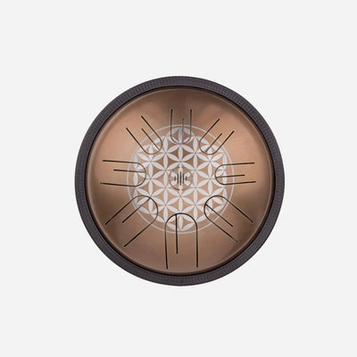 Front view of Novadrum 28 steel tongue drum in stainless steel, with precision-cut tongues arranged symmetrically around a central logo with Flower of Life engraving.