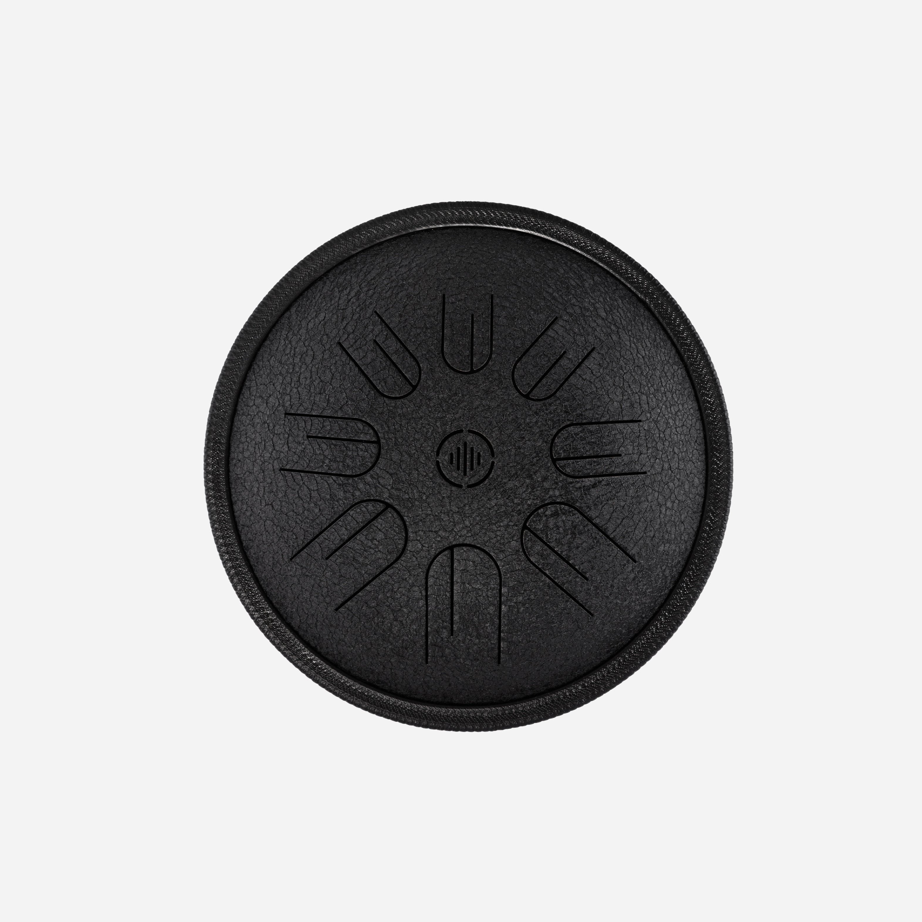 Front view of Novadrum 28 steel tongue drum in black textured finish, with precision-cut tongues arranged symmetrically around a central logo.