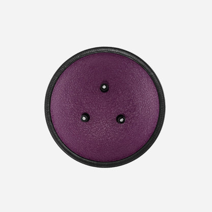 Back view of the Novadrum 28 steel tongue drum in purple textured finish, featuring three rubber feet and a black protective rim