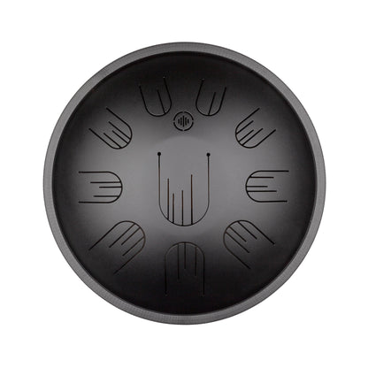 Front view of Novadrum38 steel tongue drum in black matte, with precision-cut tongues arranged symmetrically around a central logo.