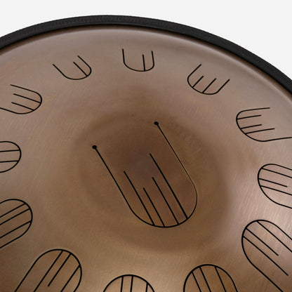 Close-up front view of Novadrum 48 big steel tongue drum in stainless steel, highlighting precision-cut tongues and centered logo.