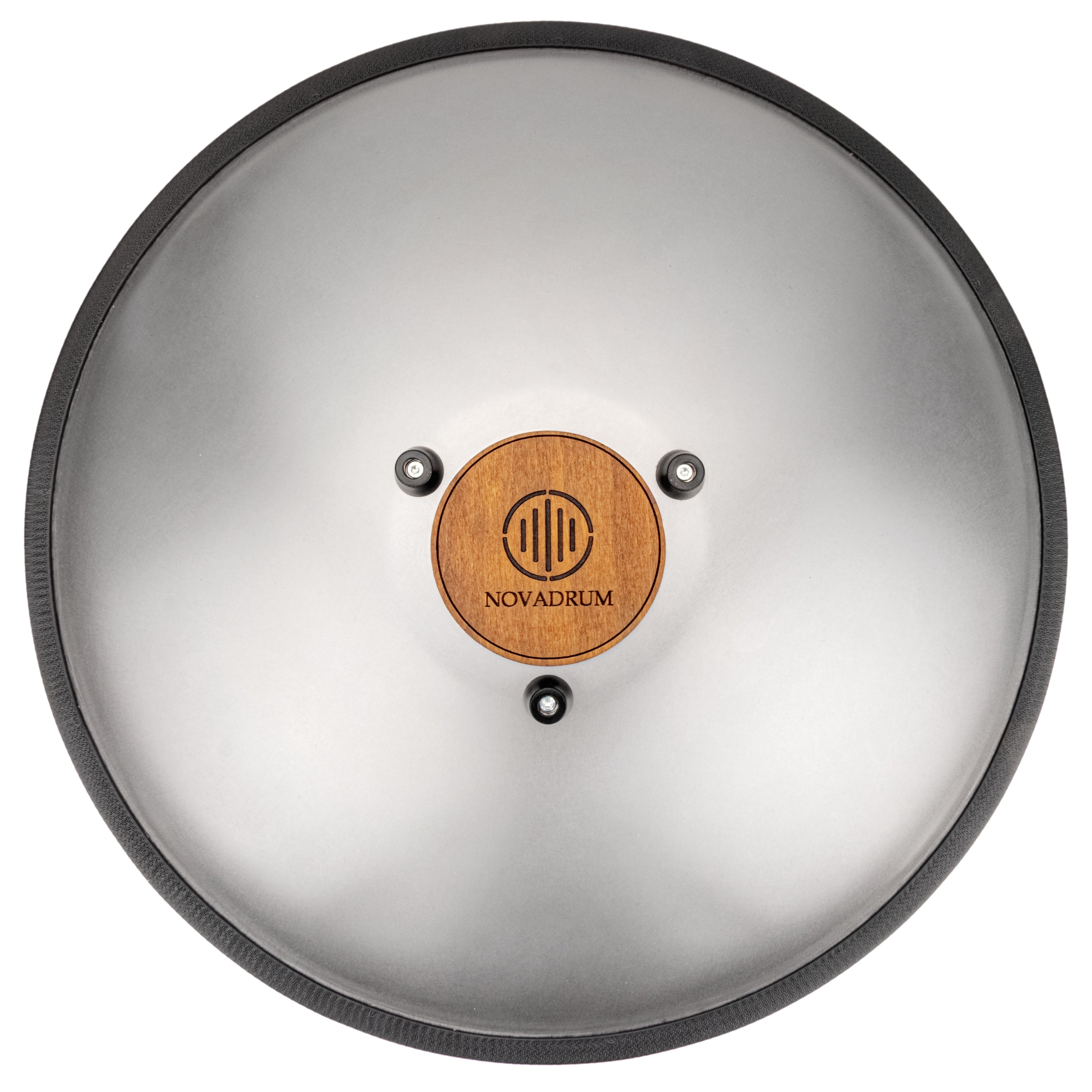Back view of Novadrum48 big steel tongue drum in stainless steel, showing a wooden cover with engraved ‘NovaDrum’ branding, rubber feet, and black rope rim.