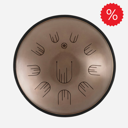 Front view of Novadrum 48 big steel tongue drum in stainless steel, with precision-cut tongues arranged symmetrically around a central logo, with discount icon